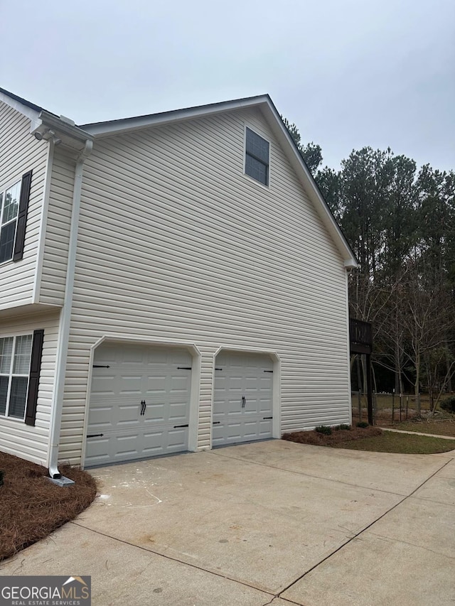 view of property exterior featuring a garage