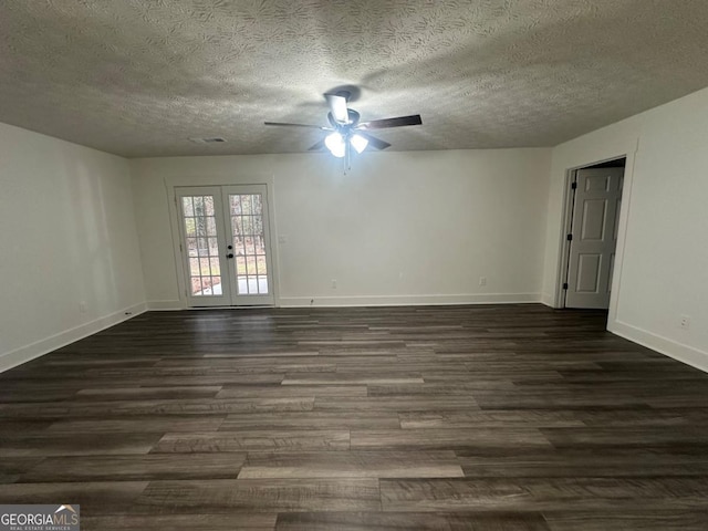 empty room featuring dark hardwood / wood-style flooring, ceiling fan, french doors, and a textured ceiling