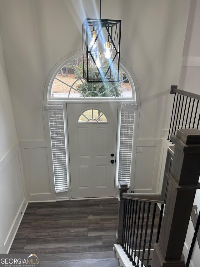 foyer with dark wood-type flooring