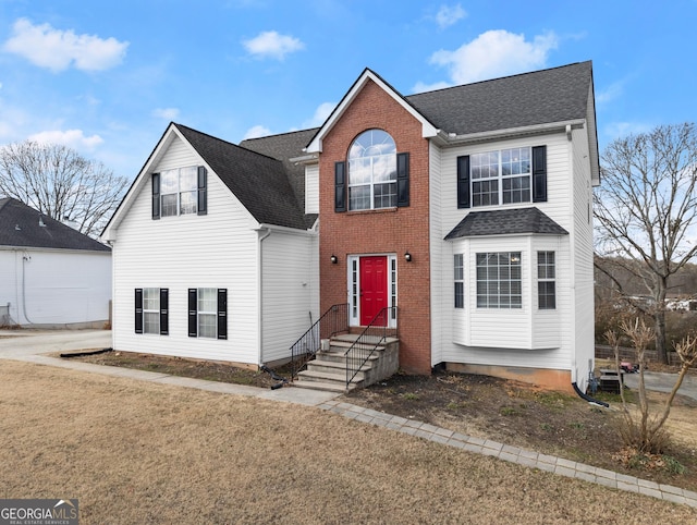 view of property featuring a front yard