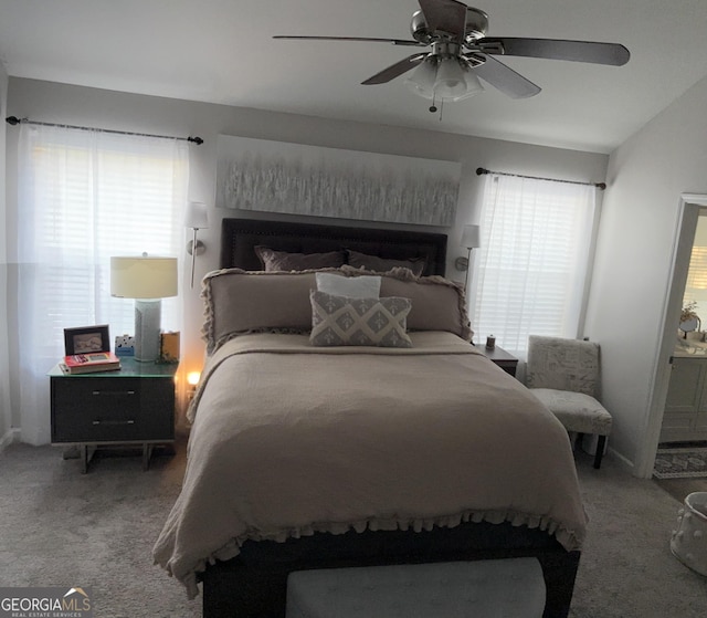 bedroom with a ceiling fan and carpet flooring