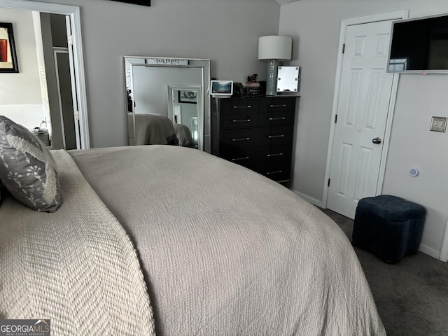 bedroom with carpet and baseboards