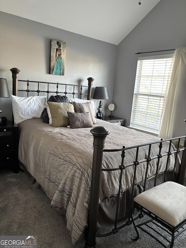 carpeted bedroom featuring vaulted ceiling