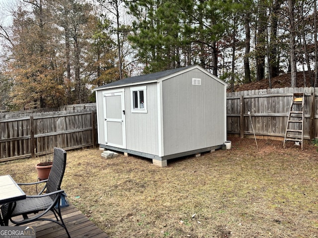 view of shed featuring a fenced backyard