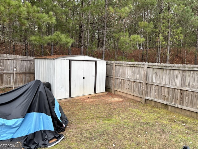 view of shed featuring a fenced backyard