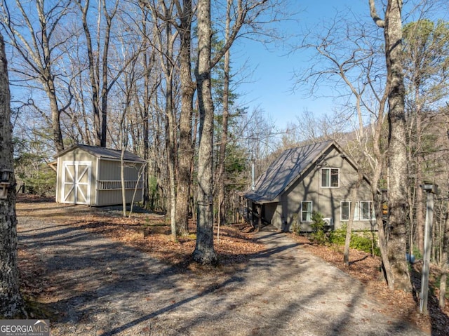 view of front of property with a shed