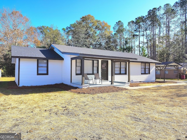 single story home with a patio and a front lawn