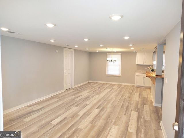 unfurnished living room with light wood-type flooring