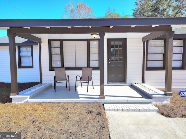 doorway to property with a porch