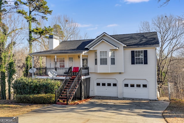 view of front of property with a porch and a garage