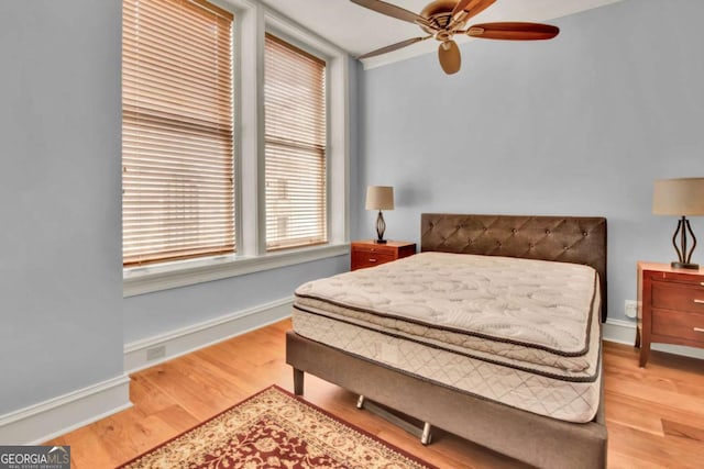 bedroom featuring wood-type flooring and ceiling fan