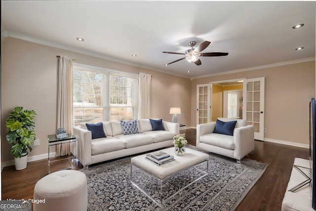 living room featuring crown molding, dark wood-type flooring, ceiling fan, and french doors