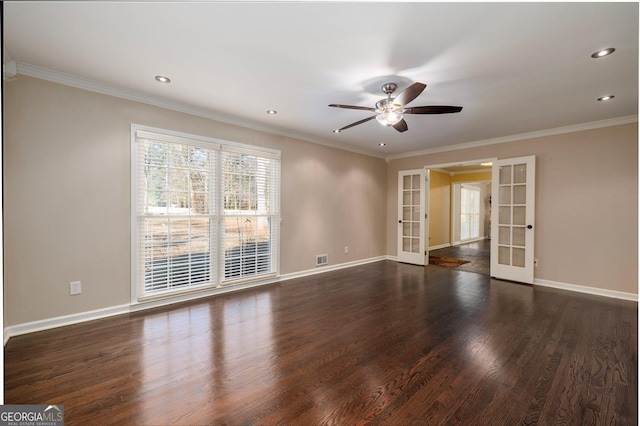 spare room featuring dark hardwood / wood-style flooring, ornamental molding, french doors, and ceiling fan