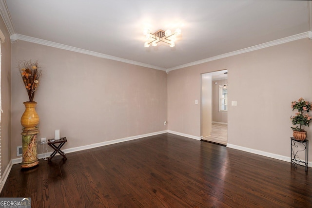 spare room with dark wood-type flooring and ornamental molding