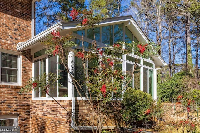 view of home's exterior featuring a sunroom