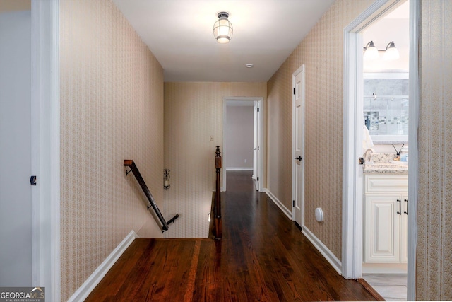 corridor featuring dark hardwood / wood-style flooring