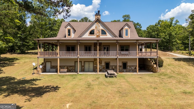 back of house with a yard, a patio, and a deck