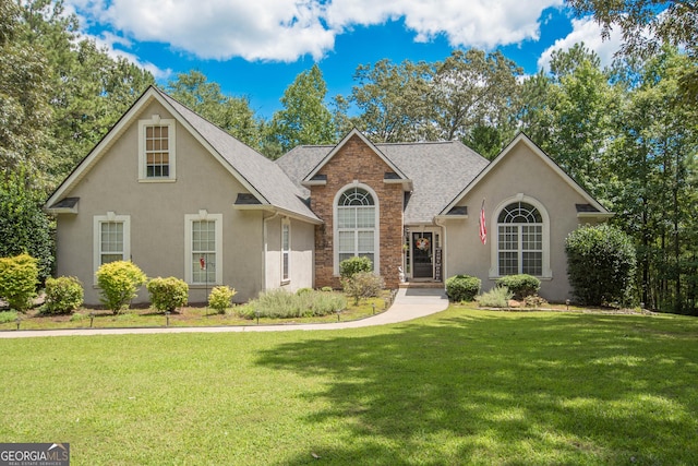 view of property with a front lawn