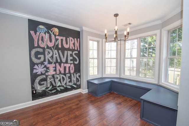 unfurnished dining area with crown molding, dark hardwood / wood-style floors, and a notable chandelier