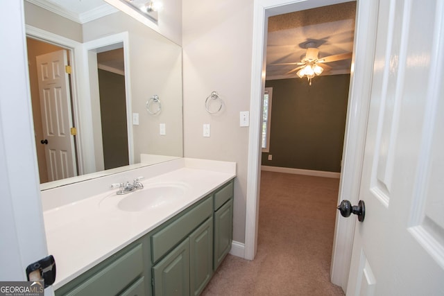 bathroom with vanity, ornamental molding, and ceiling fan