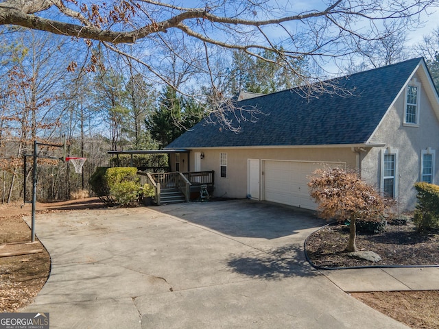 view of side of property with a garage