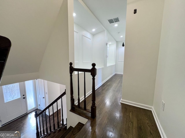 hall with dark wood-type flooring