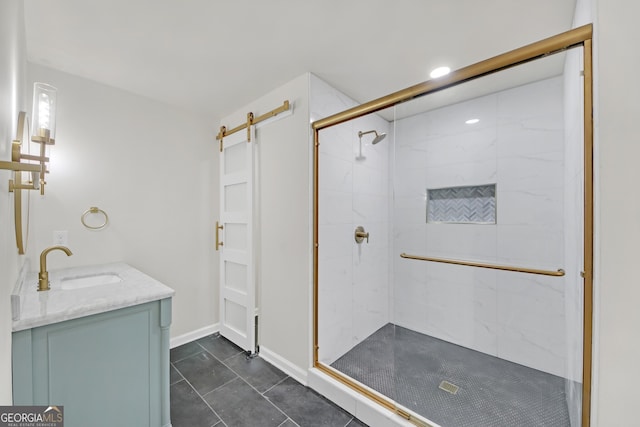 bathroom featuring tile patterned flooring, vanity, and walk in shower