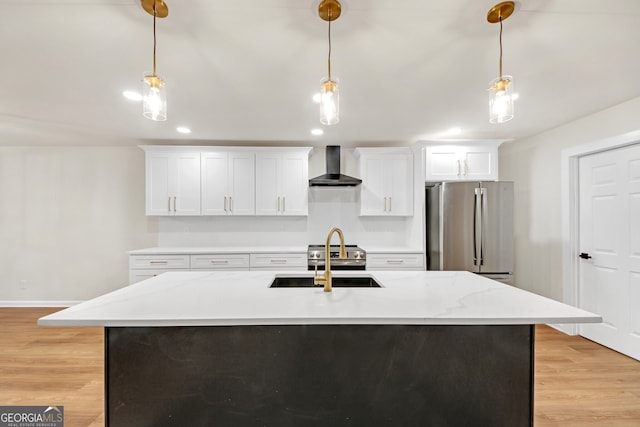 kitchen featuring wall chimney exhaust hood, hanging light fixtures, and appliances with stainless steel finishes