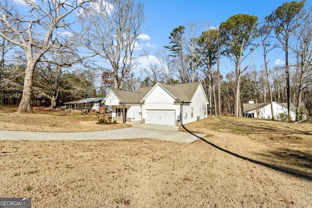 view of home's exterior featuring a yard and a garage