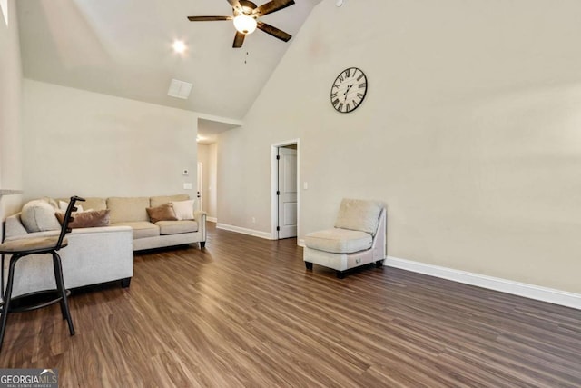 living room featuring ceiling fan, dark hardwood / wood-style flooring, and high vaulted ceiling