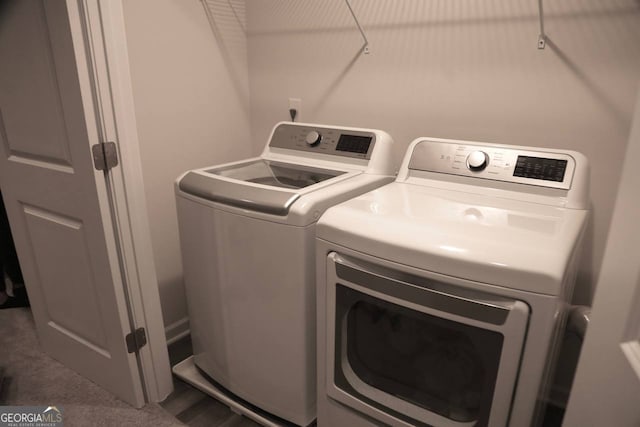 washroom featuring washing machine and dryer