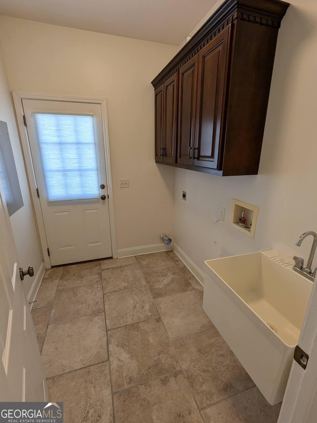 clothes washing area with cabinets, hookup for a washing machine, and electric dryer hookup