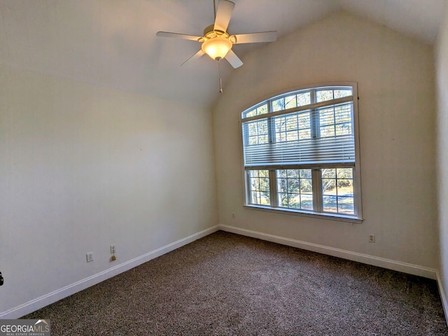 empty room featuring carpet, vaulted ceiling, and ceiling fan