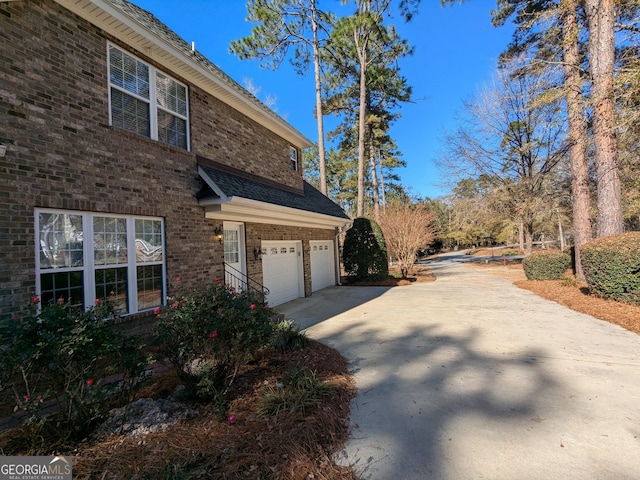 view of side of property with a garage