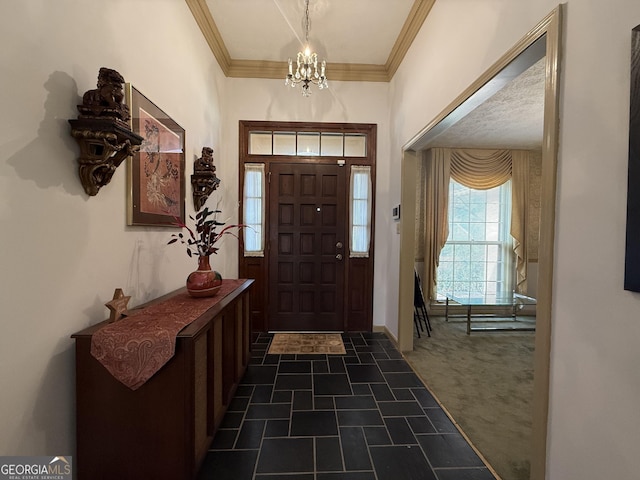 carpeted entrance foyer with a chandelier and crown molding