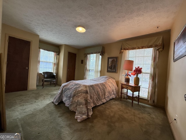 carpeted bedroom with a textured ceiling