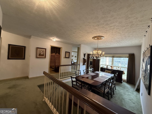 carpeted dining area featuring a textured ceiling and an inviting chandelier