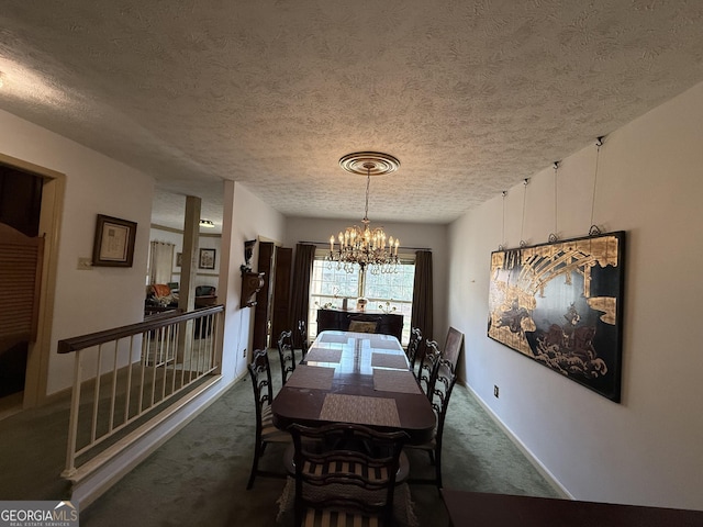 dining room featuring dark colored carpet, a textured ceiling, and a notable chandelier