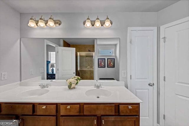 bathroom with vanity and an enclosed shower