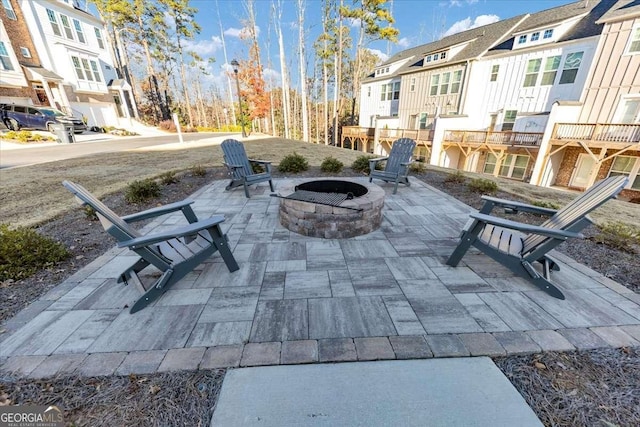 view of patio with a fire pit