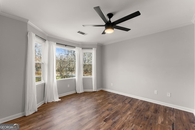 spare room featuring ceiling fan, ornamental molding, and dark hardwood / wood-style flooring