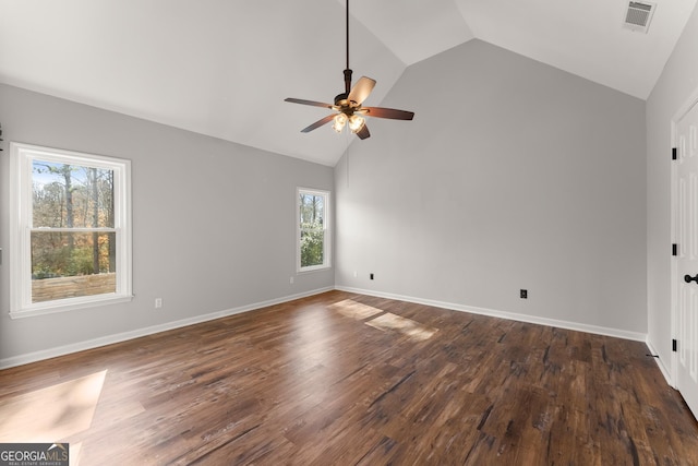 unfurnished room with dark wood-type flooring, ceiling fan, plenty of natural light, and lofted ceiling