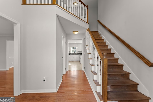 staircase featuring hardwood / wood-style floors