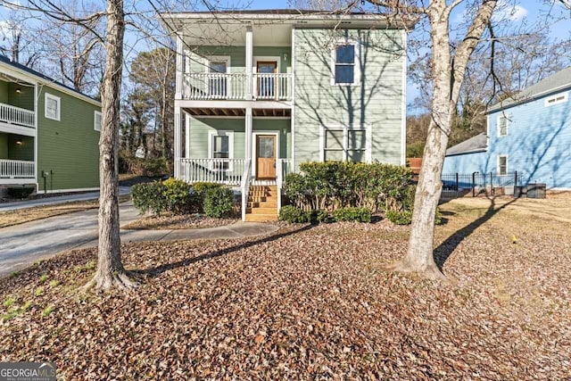 view of front of house with a balcony