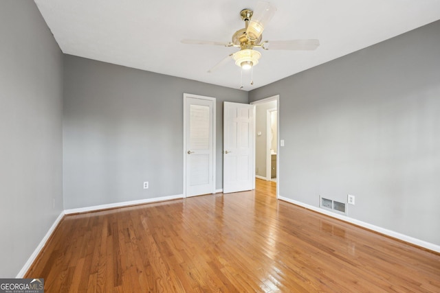 spare room with ceiling fan and light hardwood / wood-style floors