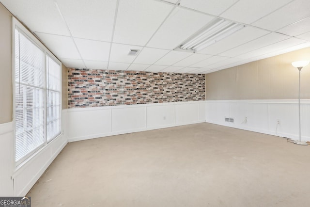 spare room featuring a paneled ceiling