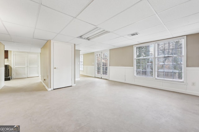 unfurnished room with a paneled ceiling