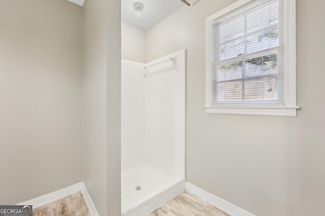 bathroom featuring walk in shower