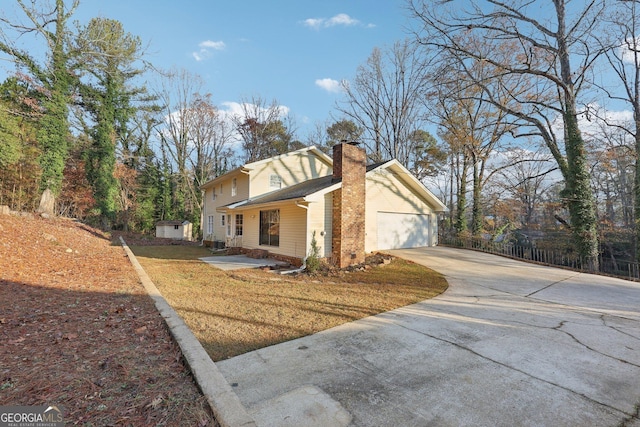 view of property exterior with a lawn and a garage