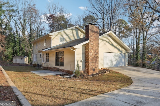 view of front of property with a storage unit, cooling unit, a garage, and a front lawn